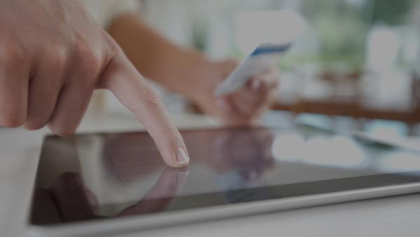 Person interacting with tablet device 