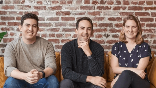 Hex technology founders seated together on a couch and smiling