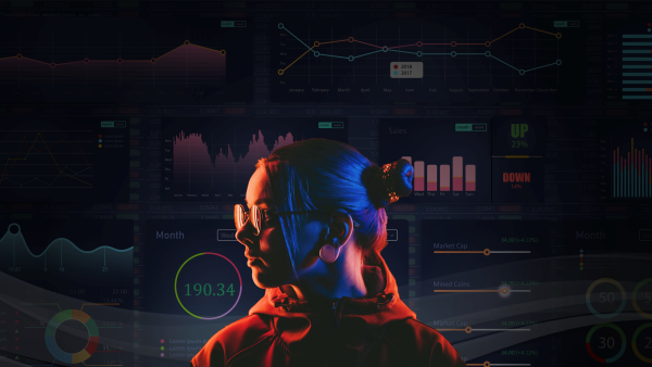 Profile of a person in front of a computer dashboard