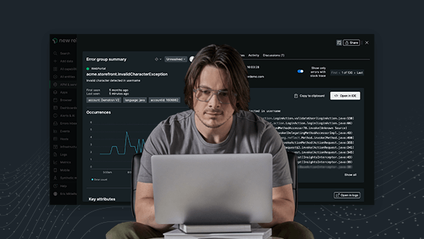 Individual using a laptop with New Relic dashboard as the background